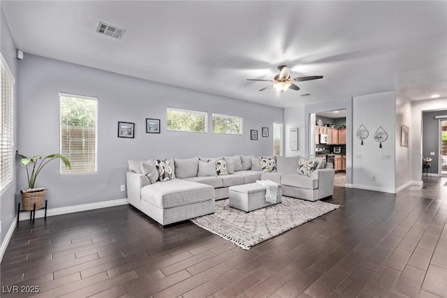 3005 Dotted Wren Ave, North Las Vegas, NV 89084 - living room featuring dark wood-style floors, baseboards, and ceiling fan