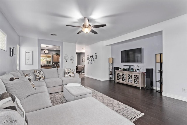 3005 Dotted Wren Ave, North Las Vegas, NV 89084 - living area with ceiling fan, dark wood-style floors, and baseboards