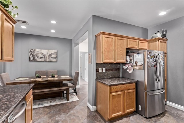 3005 Dotted Wren Ave, North Las Vegas, NV 89084 - kitchen featuring appliances with stainless steel finishes, tasteful backsplash, recessed lighting, baseboards, and dark stone counters