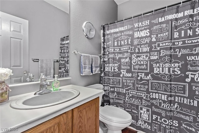 3005 Dotted Wren Ave, North Las Vegas, NV 89084 - bathroom with toilet, a textured wall, and vanity