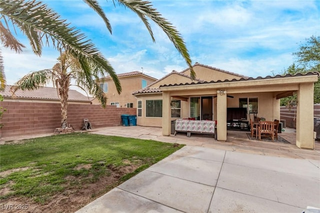 3005 Dotted Wren Ave, North Las Vegas, NV 89084 - back of property with a patio area, stucco siding, and a tiled roof