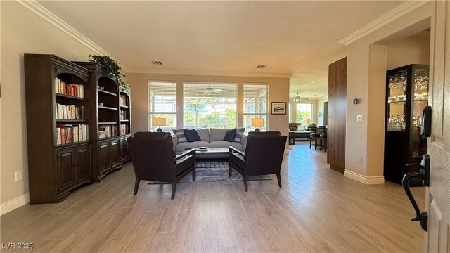 4299 Fiore Bella Blvd, Las Vegas, NV 89135 - living room with light wood finished floors, baseboards, and crown molding