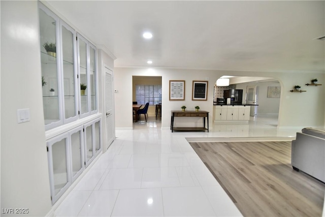 2926 E Eldorado Ln, Las Vegas, NV 89120 - corridor with arched walkways, recessed lighting, baseboards, and light tile patterned flooring