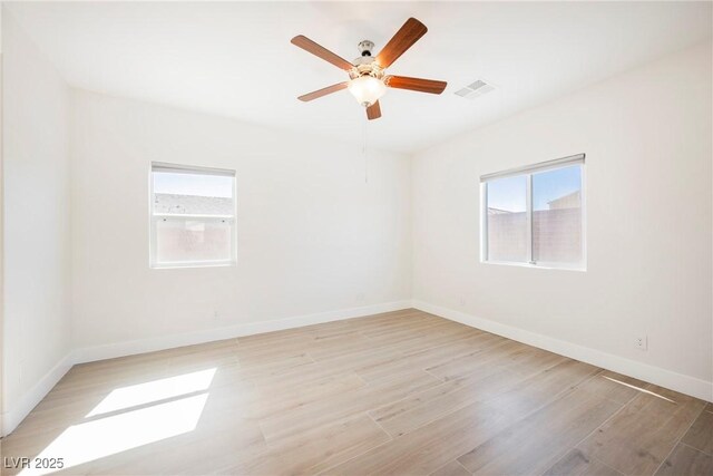 37 Late Harvest Ave, Pahrump, NV 89060 - empty room featuring light wood finished floors, baseboards, and ceiling fan