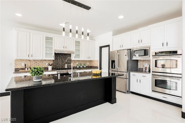 8244 Cupertino Heights Way, Las Vegas, NV 89178 - kitchen featuring appliances with stainless steel finishes, decorative backsplash, pendant lighting, white cabinetry, and recessed lighting