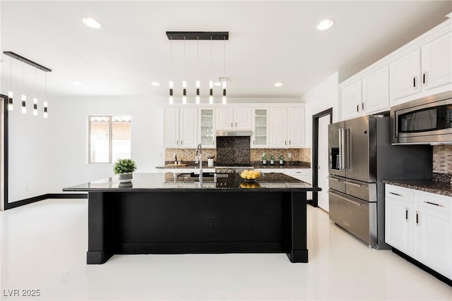 8244 Cupertino Heights Way, Las Vegas, NV 89178 - kitchen featuring stainless steel appliances, a sink, decorative backsplash, under cabinet range hood, and glass insert cabinets
