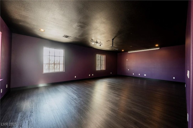 8244 Cupertino Heights Way, Las Vegas, NV 89178 - empty room featuring dark wood finished floors, baseboards, and a textured ceiling