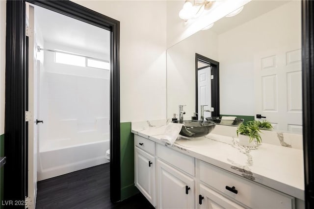 8244 Cupertino Heights Way, Las Vegas, NV 89178 - full bathroom featuring toilet, wood finished floors, vanity, and shower / bath combination