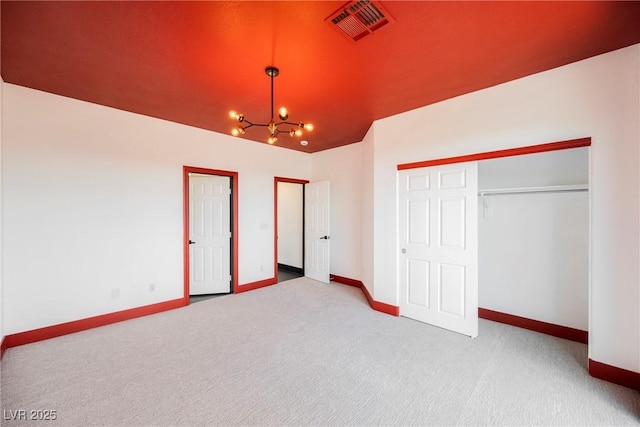 8244 Cupertino Heights Way, Las Vegas, NV 89178 - unfurnished bedroom featuring baseboards, a chandelier, carpet floors, and a closet