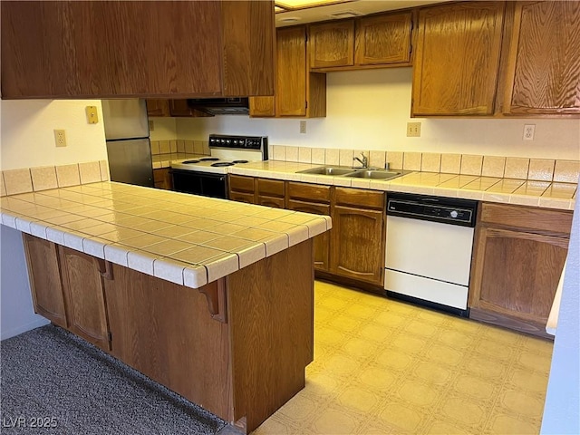 4121 Gannet Cir Unit 414, Las Vegas, NV 89103 - kitchen featuring white appliances, a sink, ventilation hood, light flooring, and a peninsula