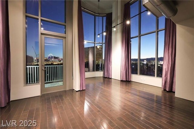 360 E Desert Inn Rd Unit 807, Las Vegas, NV 89109 - spare room with a towering ceiling and wood finished floors