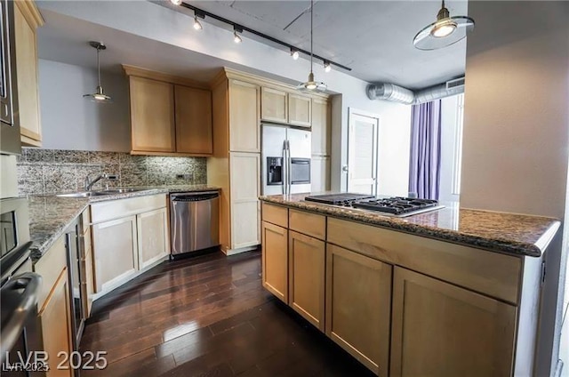 360 E Desert Inn Rd Unit 807, Las Vegas, NV 89109 - kitchen with appliances with stainless steel finishes, a sink, tasteful backsplash, dark wood-style floors, and dark stone countertops