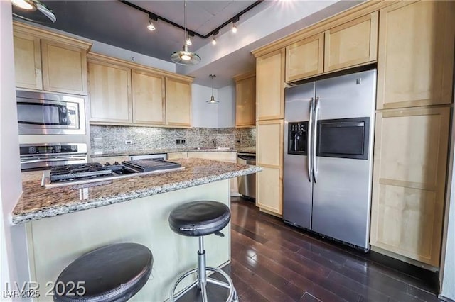 360 E Desert Inn Rd Unit 807, Las Vegas, NV 89109 - kitchen with stainless steel appliances, light brown cabinetry, dark wood-style floors, and track lighting