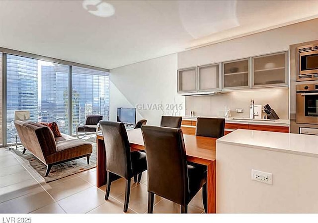 dining area featuring light tile patterned floors