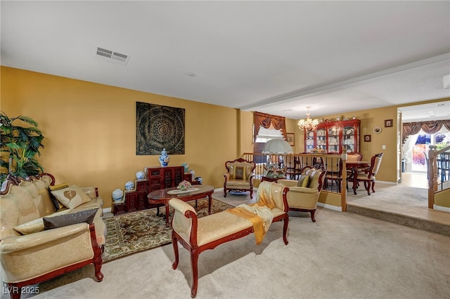 living room featuring a chandelier and light colored carpet