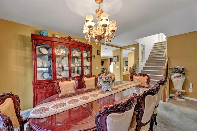 dining room featuring a chandelier, carpet flooring, stairway, and baseboards