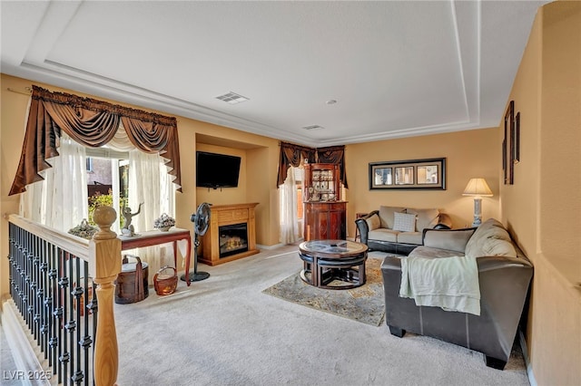 living area featuring carpet floors and a fireplace