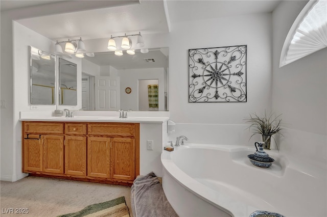 bathroom featuring a garden tub, double vanity, and a chandelier