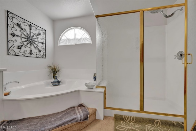 full bathroom featuring a stall shower and a garden tub