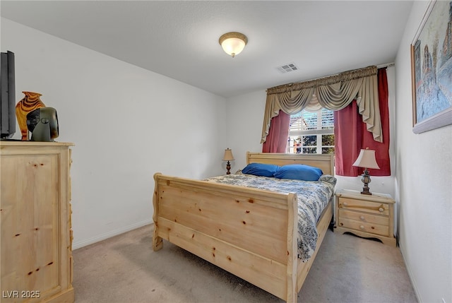 bedroom with carpet floors and baseboards