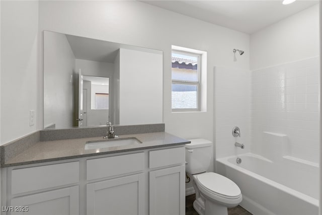 full bath with toilet, vanity, and bathtub / shower combination