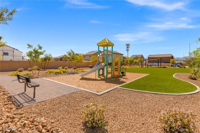 communal playground featuring a residential view