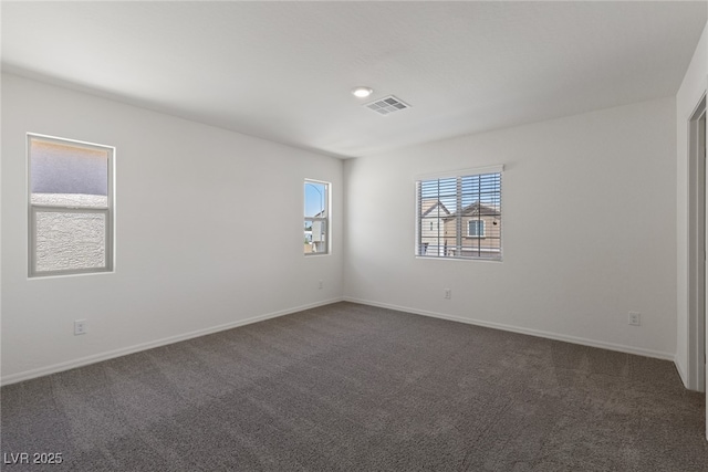 6233 Blood Lily Ave, Las Vegas, NV 89122 - empty room with dark colored carpet and baseboards
