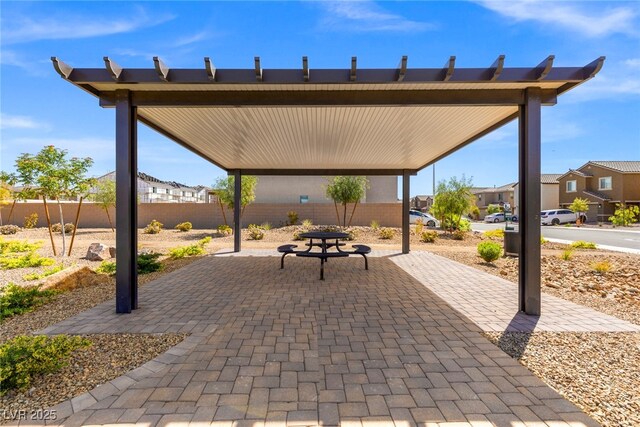 6233 Blood Lily Ave, Las Vegas, NV 89122 - view of patio / terrace with fence and a residential view