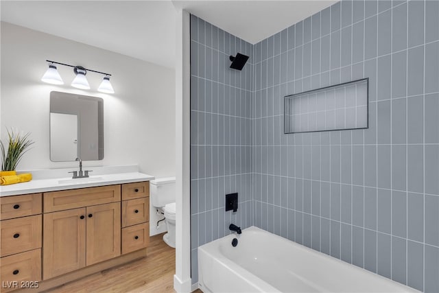 405 Oil Lantern Ln, Las Vegas, NV 89145 - bathroom featuring toilet, vanity, washtub / shower combination, and wood finished floors