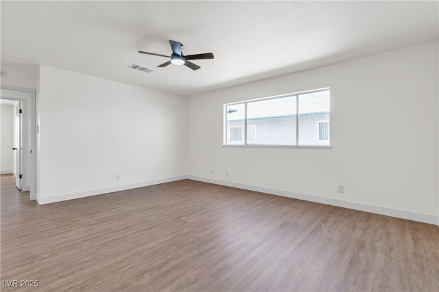 405 Oil Lantern Ln, Las Vegas, NV 89145 - empty room with a ceiling fan, wood finished floors, and baseboards