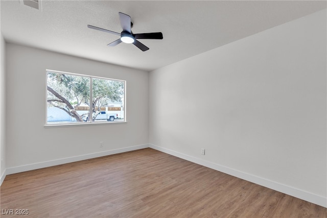 405 Oil Lantern Ln, Las Vegas, NV 89145 - unfurnished room featuring wood finished floors, ceiling fan, and baseboards