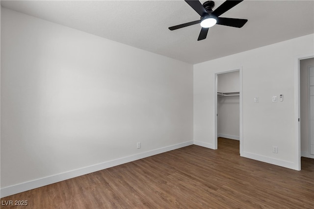 405 Oil Lantern Ln, Las Vegas, NV 89145 - unfurnished bedroom with baseboards, wood finished floors, a spacious closet, and a closet