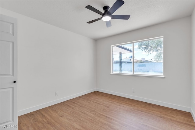 405 Oil Lantern Ln, Las Vegas, NV 89145 - spare room with light wood-style floors, a ceiling fan, and baseboards