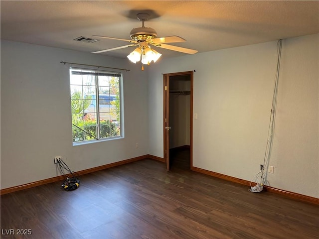 4455 W Ford Ave, Las Vegas, NV 89139 - unfurnished bedroom featuring dark wood-style floors and ceiling fan