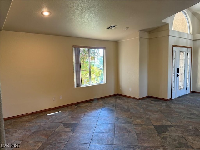 4455 W Ford Ave, Las Vegas, NV 89139 - unfurnished room featuring baseboards and a textured ceiling