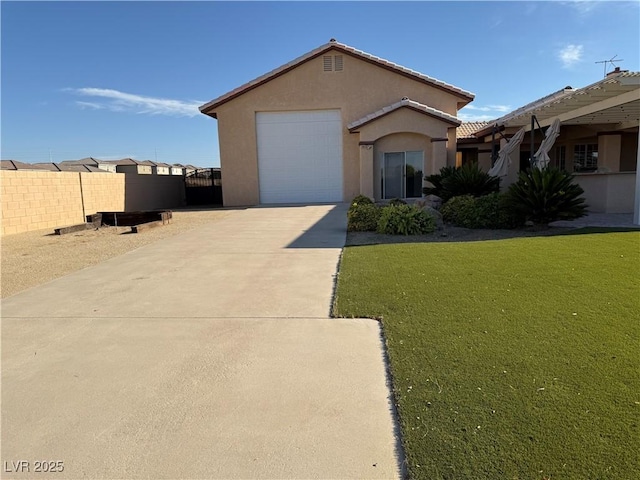 4455 W Ford Ave, Las Vegas, NV 89139 - view of front of home with stucco siding, concrete driveway, and an attached garage