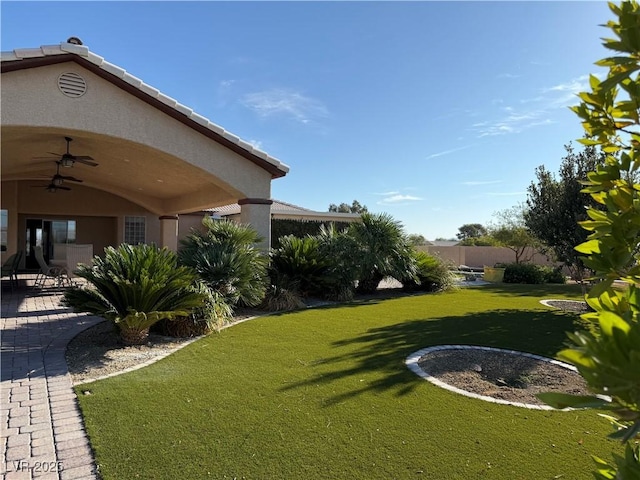 4455 W Ford Ave, Las Vegas, NV 89139 - view of grassy yard with a ceiling fan and a patio area