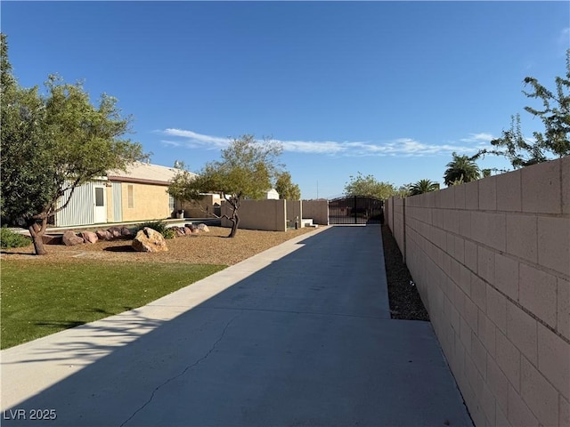 4455 W Ford Ave, Las Vegas, NV 89139 - view of concrete driveway featuring a gate