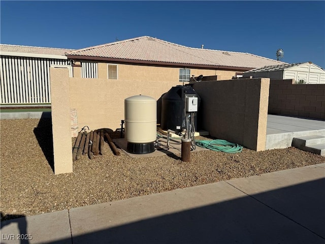 4455 W Ford Ave, Las Vegas, NV 89139 - view of side of property with stucco siding and a tiled roof