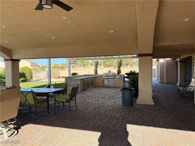 4455 W Ford Ave, Las Vegas, NV 89139 - view of patio with exterior kitchen, a ceiling fan, and outdoor dining area