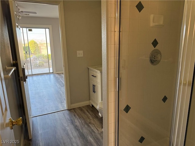 4455 W Ford Ave, Las Vegas, NV 89139 - bathroom with wood finished floors, a stall shower, and vanity