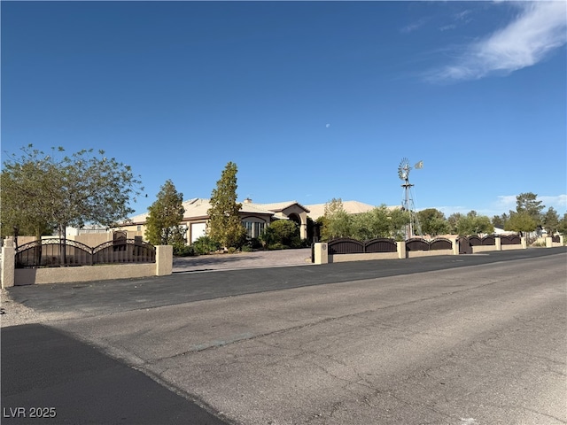4455 W Ford Ave, Las Vegas, NV 89139 - view of asphalt road with a gate