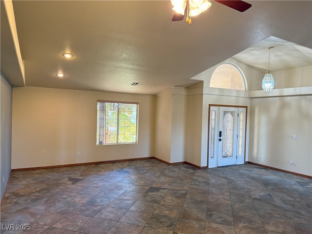 4455 W Ford Ave, Las Vegas, NV 89139 - unfurnished room with ceiling fan, stone finish flooring, and a textured ceiling