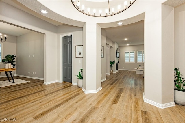 2450 Amatrice St, Henderson, NV 89044 - foyer entrance featuring a chandelier, light wood finished floors, baseboards, and recessed lighting