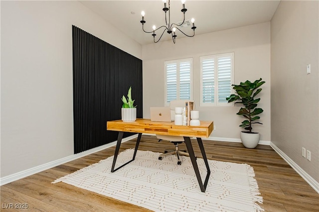 2450 Amatrice St, Henderson, NV 89044 - office space with wood finished floors, a chandelier, and baseboards