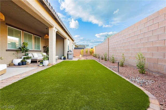 2450 Amatrice St, Henderson, NV 89044 - view of yard with an outdoor hangout area and a patio