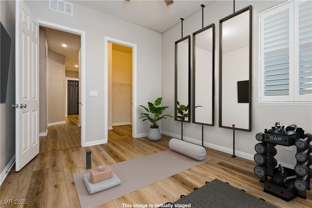 2450 Amatrice St, Henderson, NV 89044 - exercise room featuring wood finished floors and baseboards