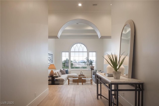 1610 Brock Ct, Las Vegas, NV 89117 - hall featuring crown molding, baseboards, arched walkways, wood-type flooring, and recessed lighting