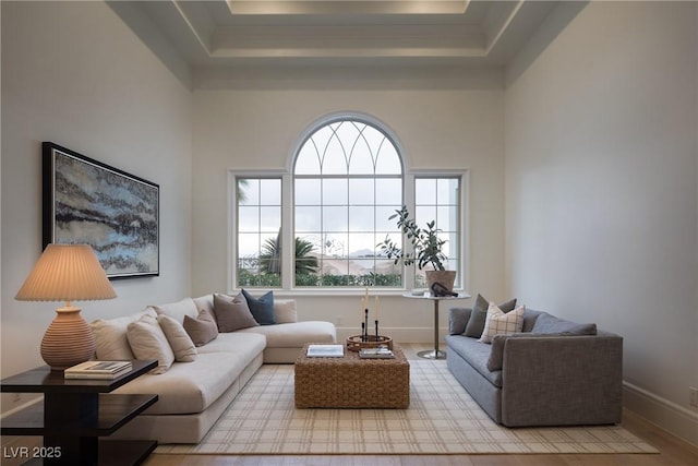 1610 Brock Ct, Las Vegas, NV 89117 - living room with a raised ceiling, plenty of natural light, baseboards, and wood finished floors