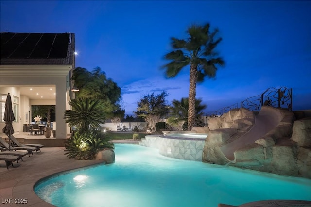 1610 Brock Ct, Las Vegas, NV 89117 - pool at twilight with a patio area and a pool with connected hot tub